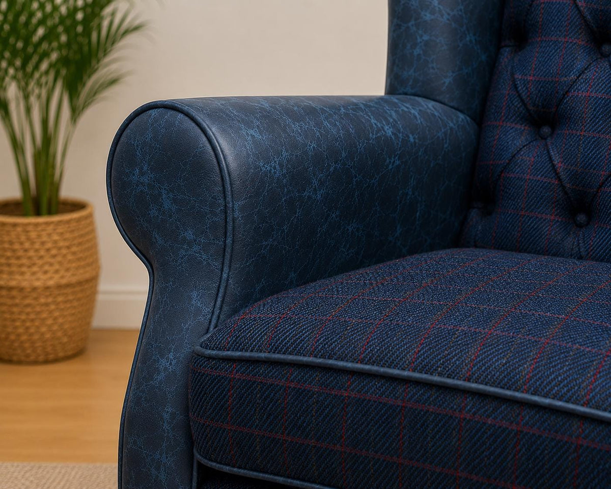 Close-up of blue Italian leather scroll arm and Royal Harris Tweed seat cushion