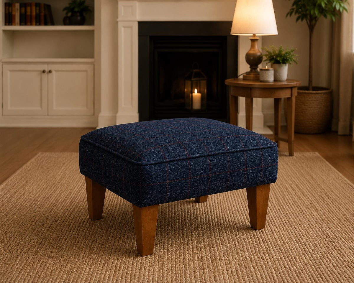 Matching blue Royal Harris Tweed footstool with Italian leather piping in a living room